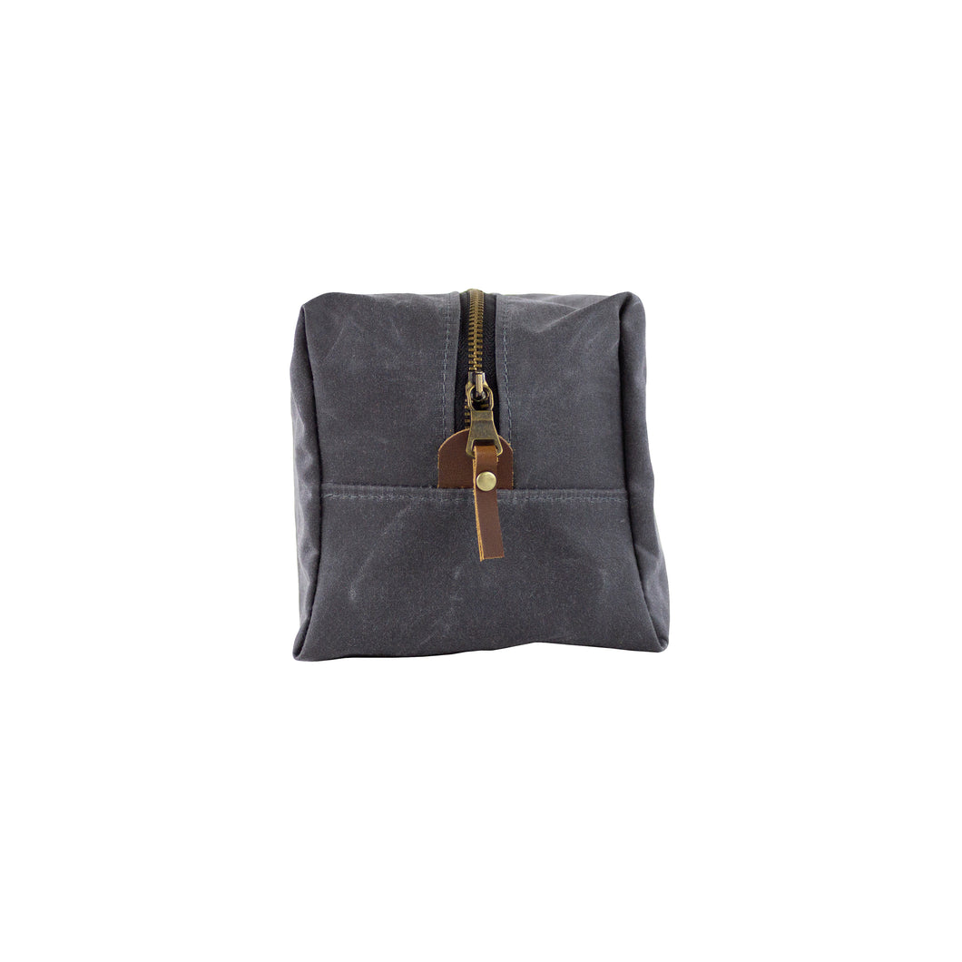 gray waxed canvas dopp kit with vegetable leather accents - front view