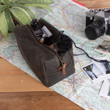 Load image into Gallery viewer, olive green waxed cotton travel kit with toiletries inside

