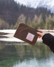 Load image into Gallery viewer, small tan zipper pouch in hand
